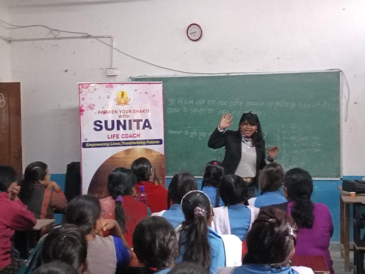 Coach Sunita Kumari speaking with students